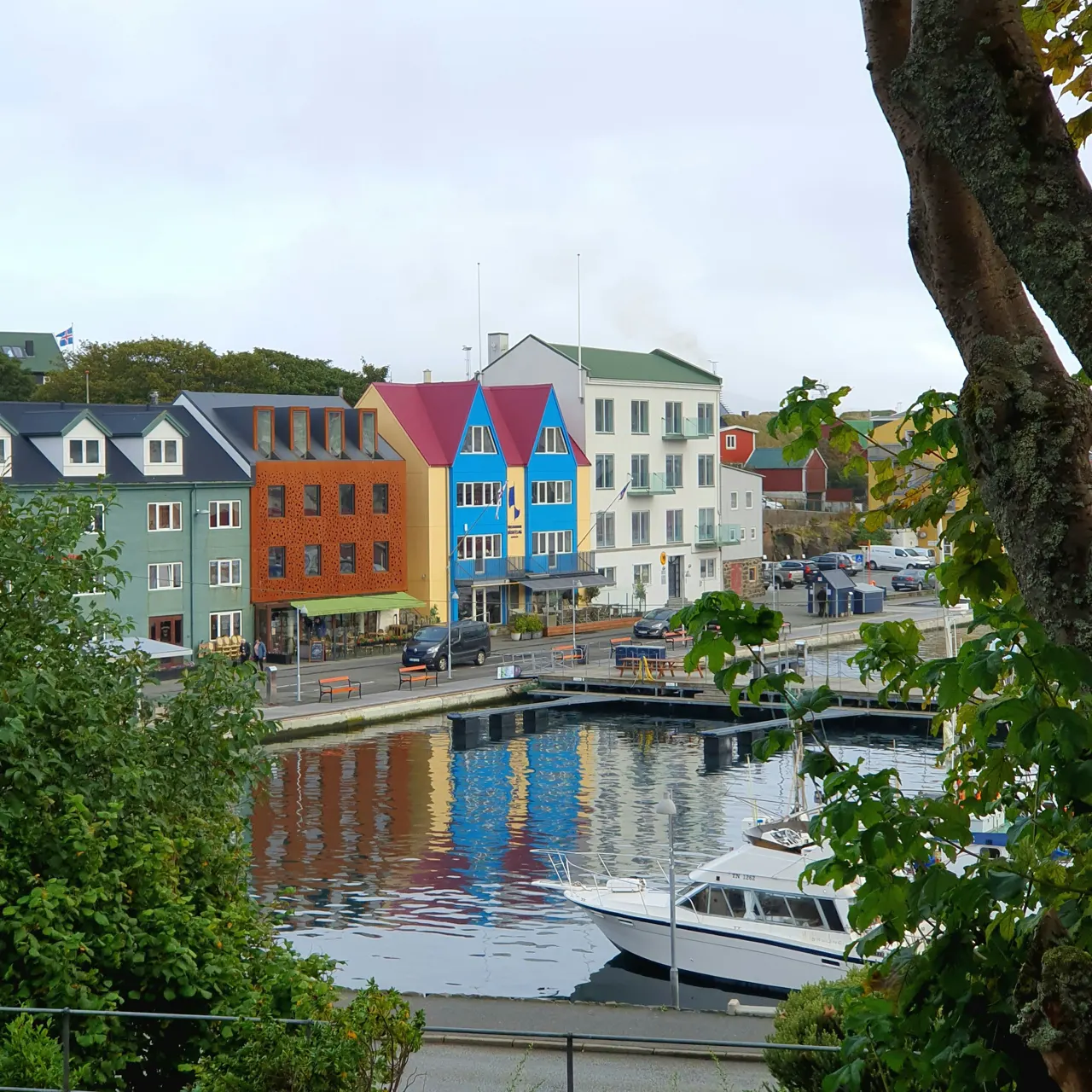 A vibrant and picturesque view of Tórshavn, the capital of the Faroe Islands, showcasing its iconic waterfront