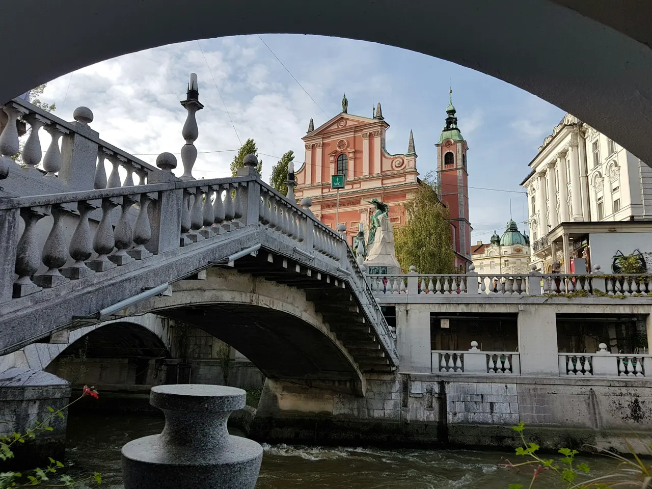 A view of the Pink church and one of the three bridges in downtown Ljubljana