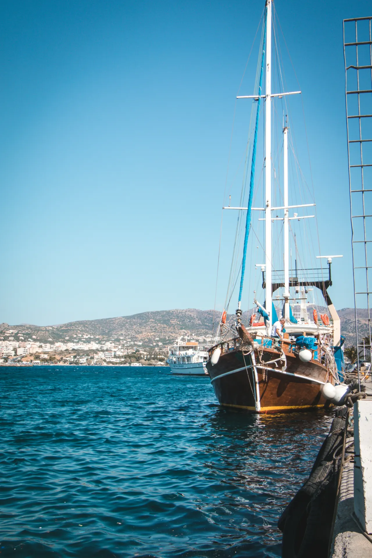 brown and white sail boat on sea during daytime