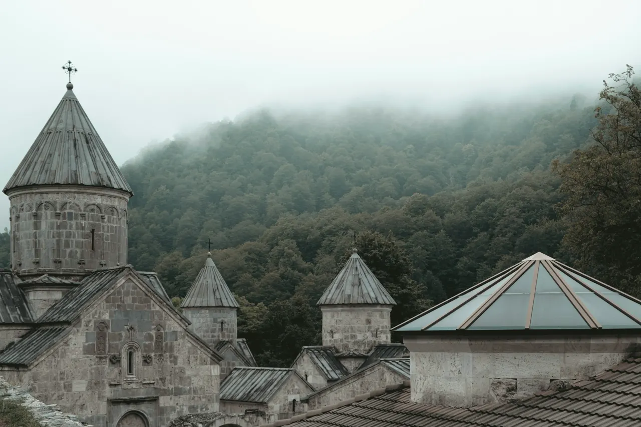a church with a steeple and a steeple with a cross on it
