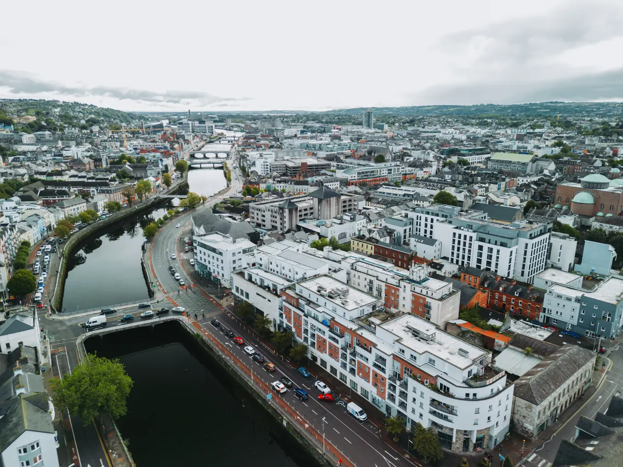 an aerial view of a city with a river running through it