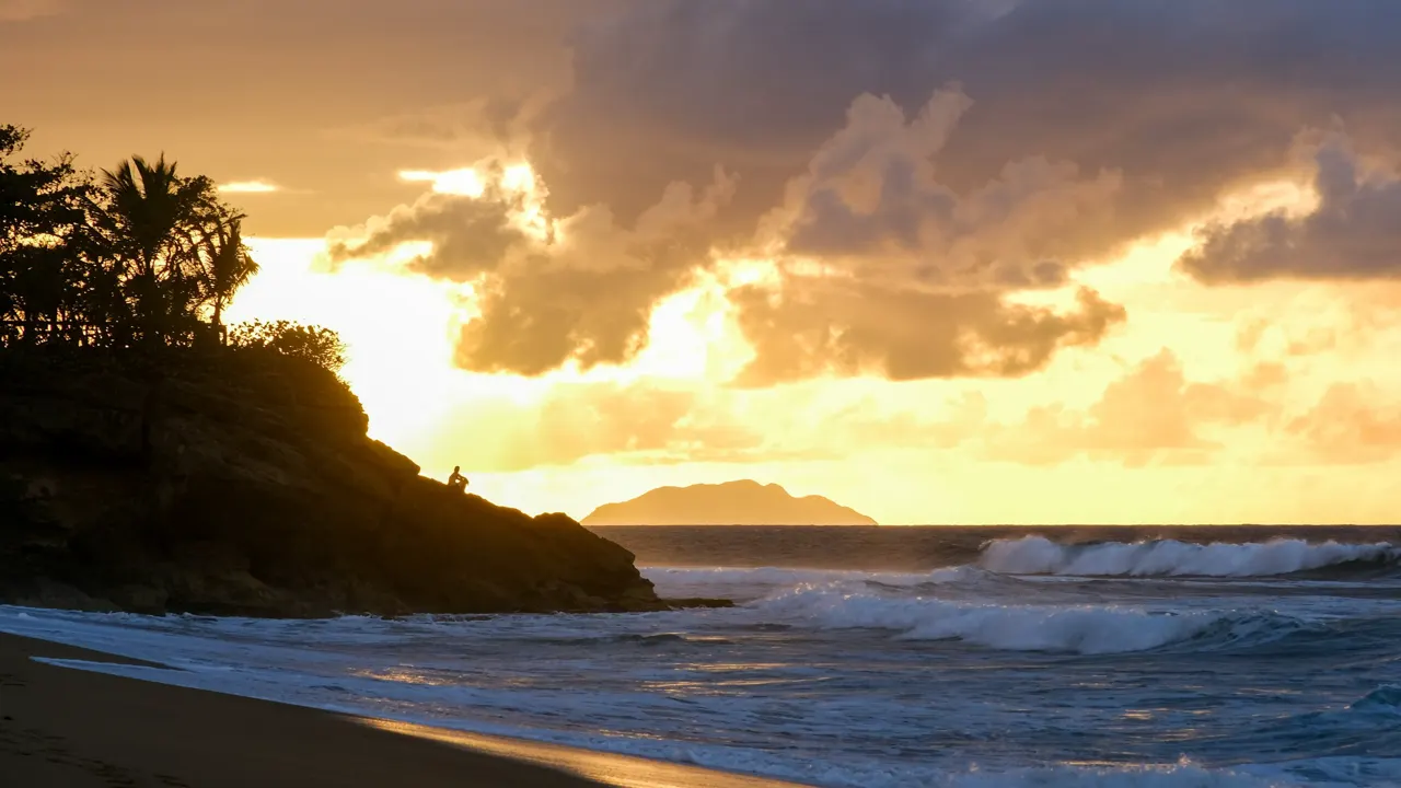 A man takes in the sunset in Puerto Ric