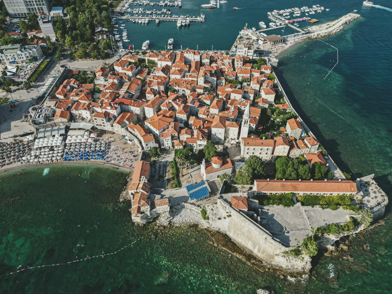 an aerial view of a small town by the water