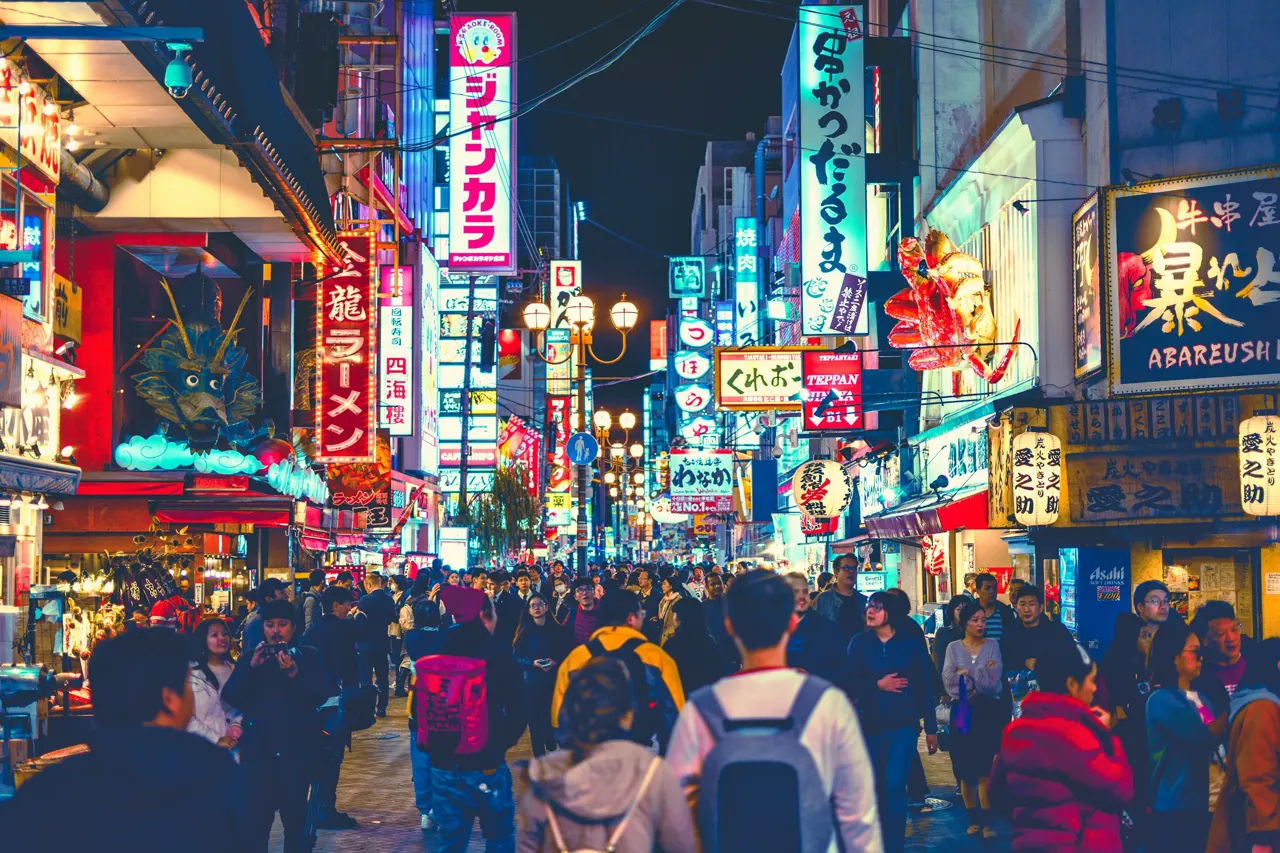 people walking on street during night time