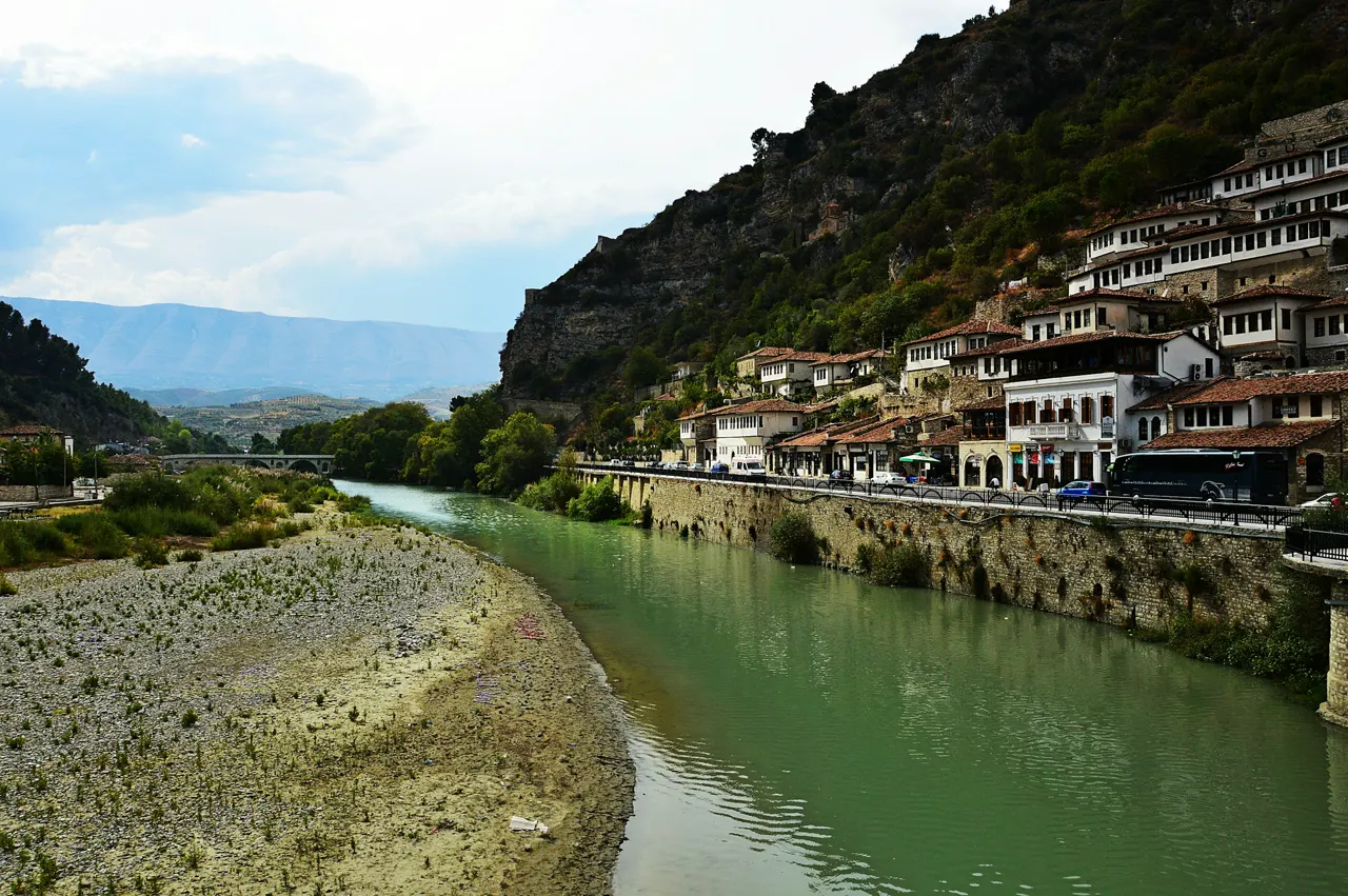a river running through a lush green valley