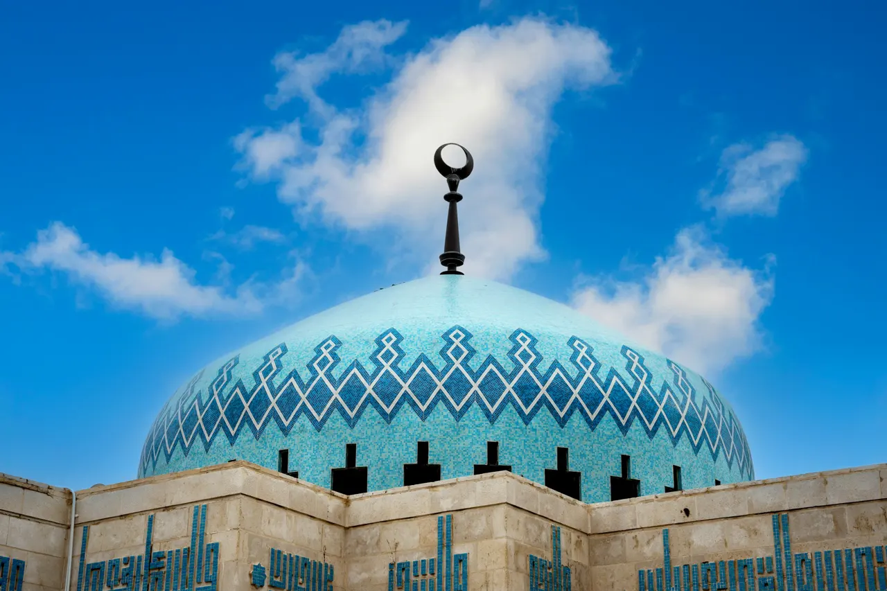 a building with a blue dome and a light pole