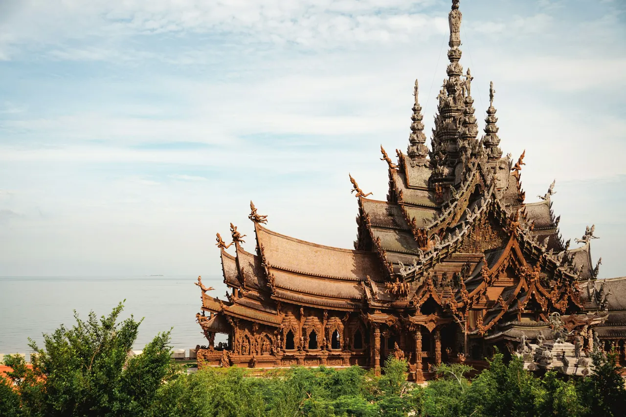 a large wooden building with many spires on top of it