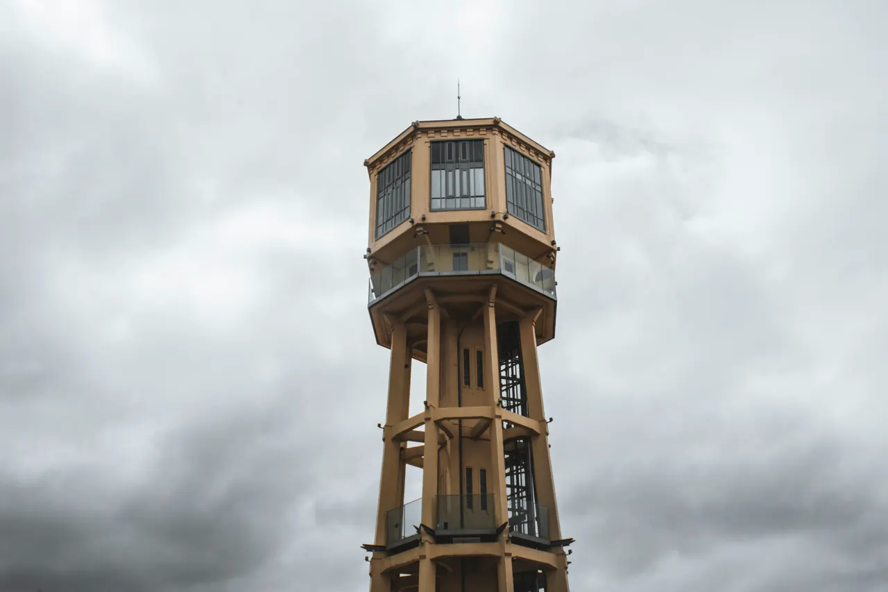 a tall tower with a clock on the top of it