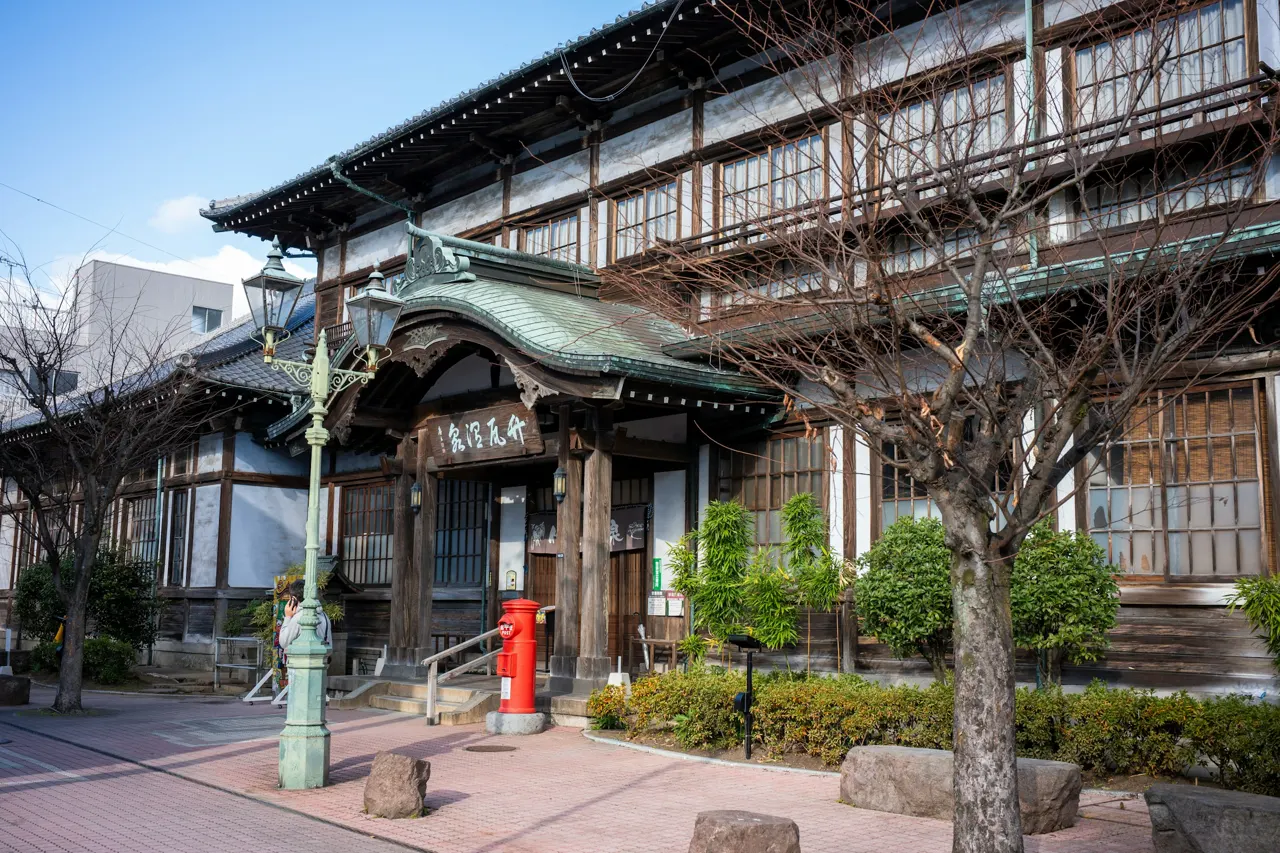 A large building with a tree in front of it