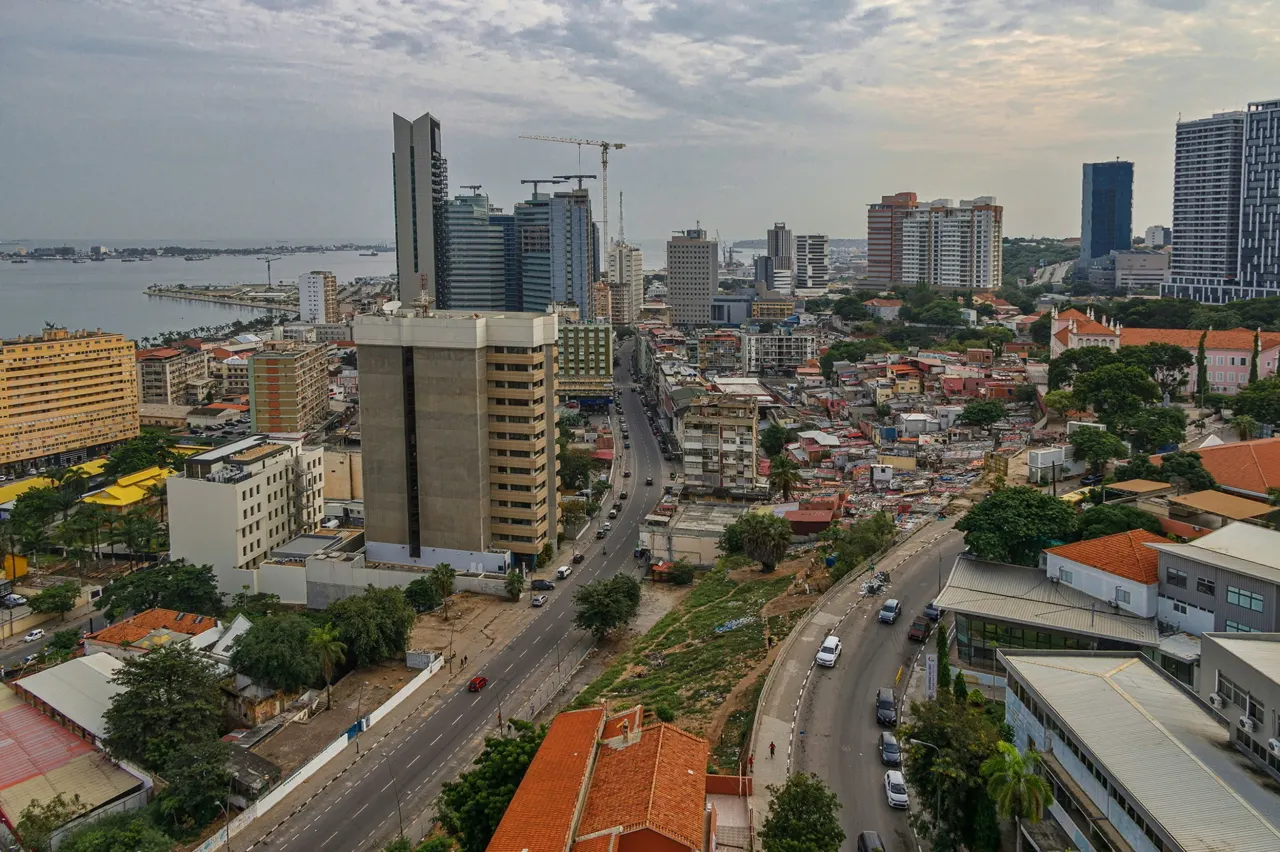 View of Luanda from above. Modern skyscrapers, colorful Portuguese colonial buildings and slum neighborhoods, all in the same district