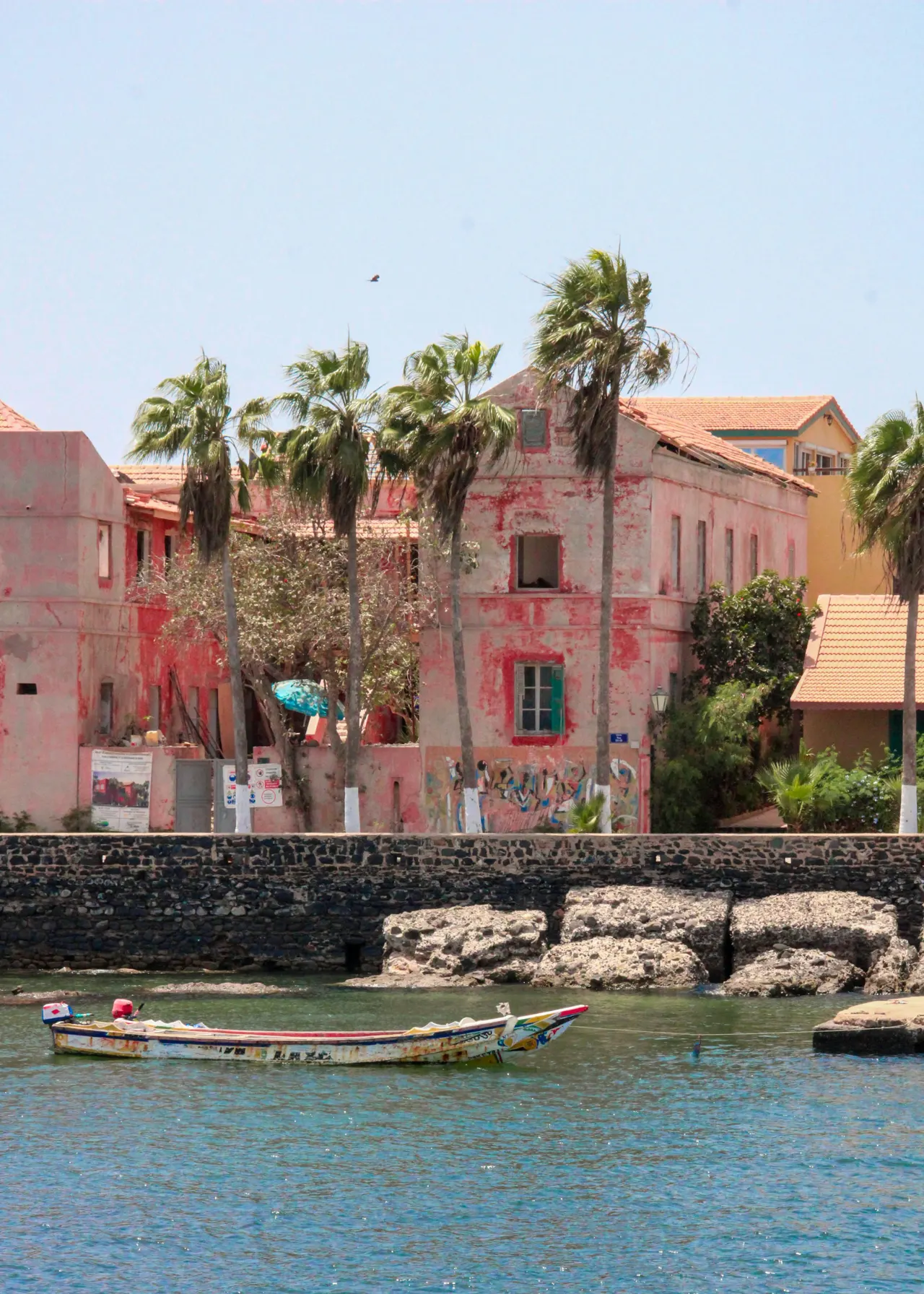 Houses and a boat on the shore of Gorée Island