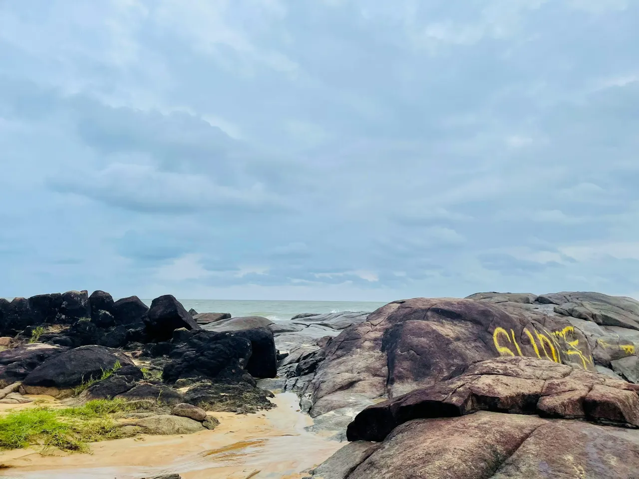 An expansive view of the rocky coastline, where the ocean meets the rugged terrain