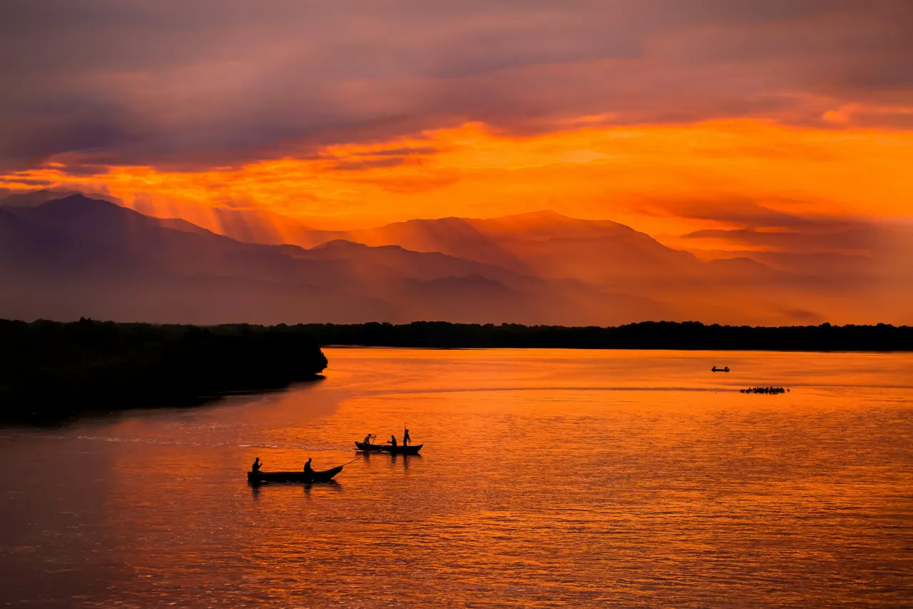 Fishermen near Santa Marta, Colombia with the Sierra Nevada mountains in the distance