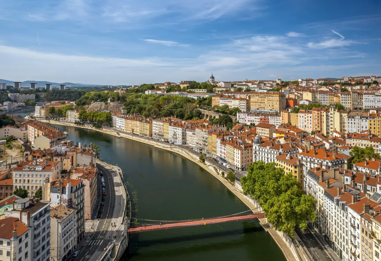 The drone aerial view of Saone River runs through the downtown district of Lyon, France