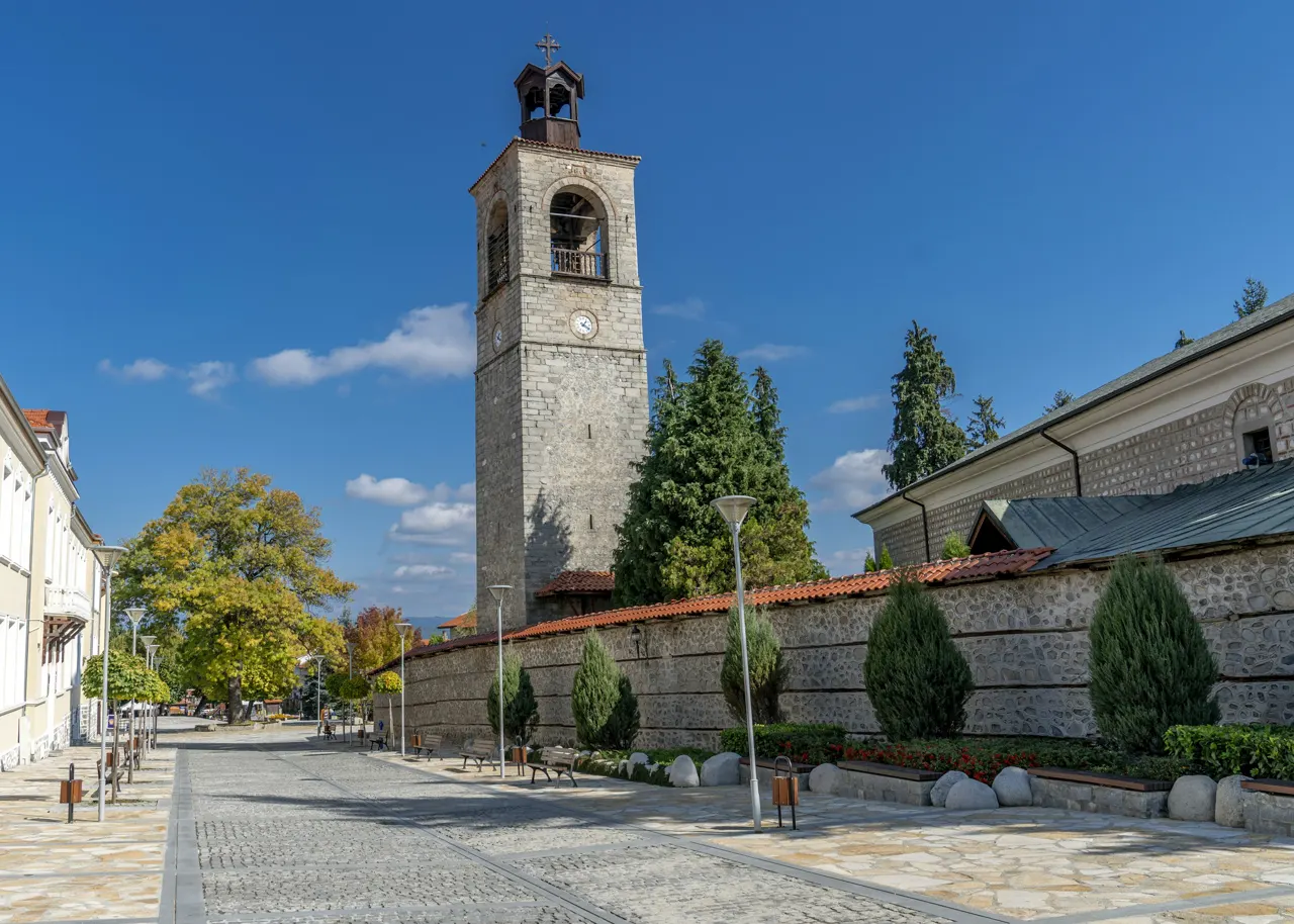 a tall clock tower towering over a city