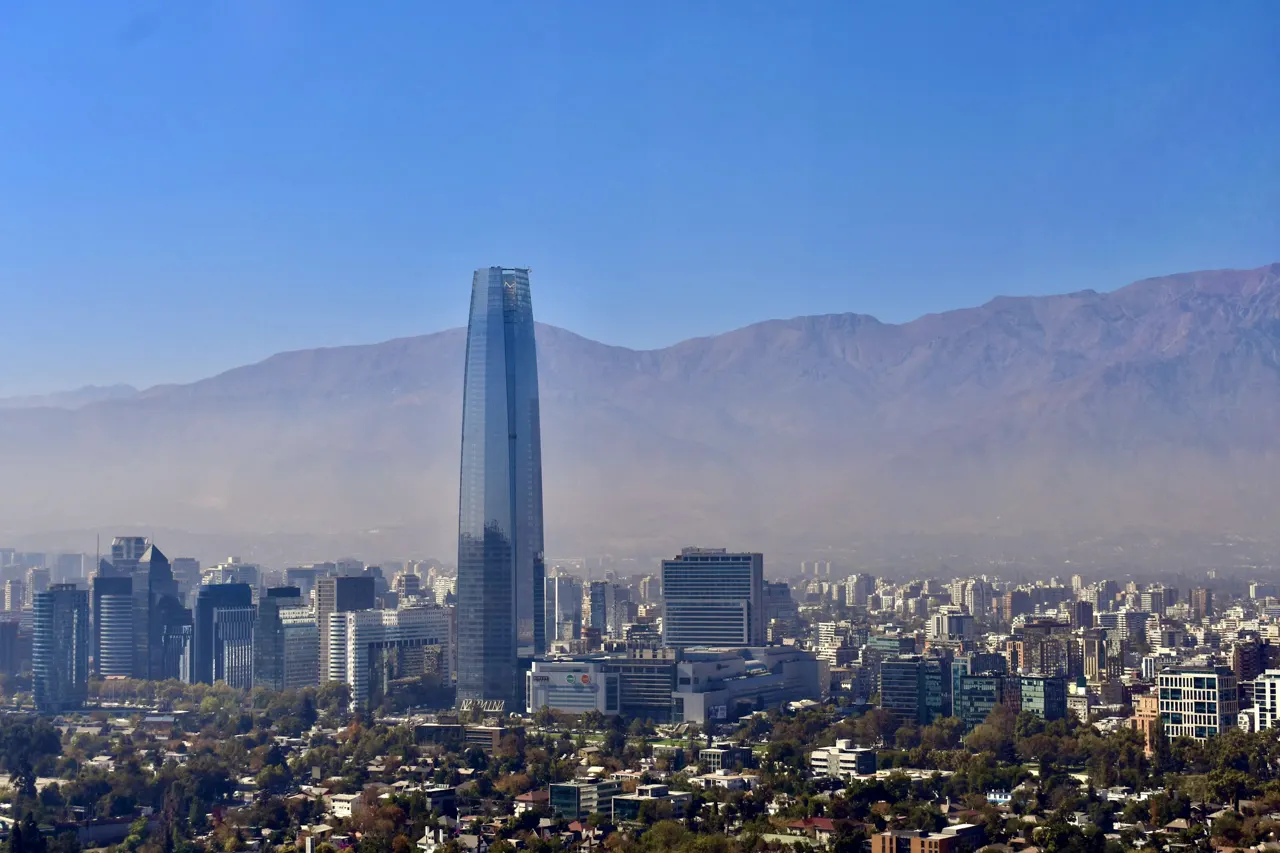 a view of a city with mountains in the background