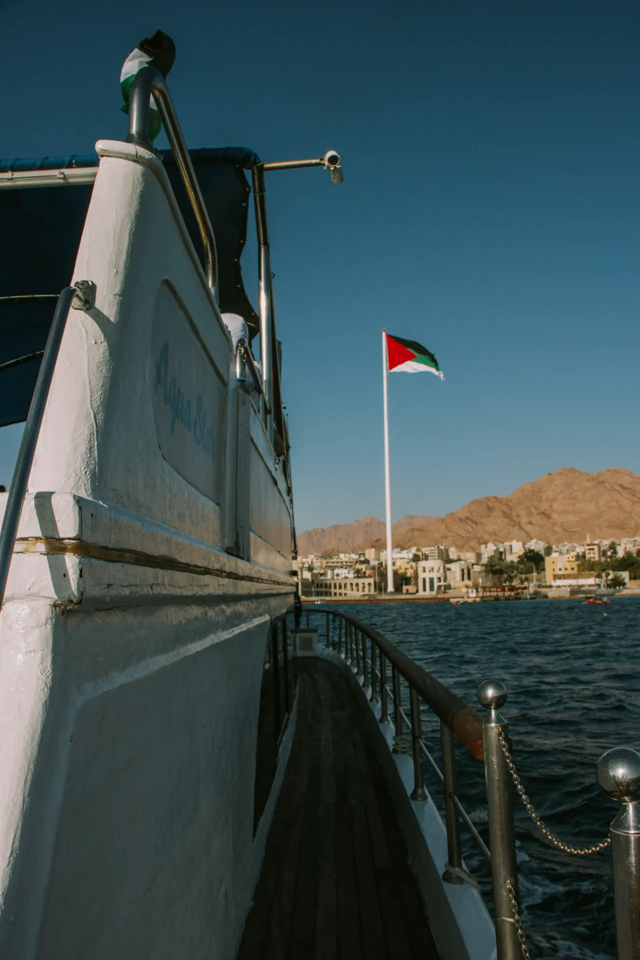 a boat with a flag on the side of it
