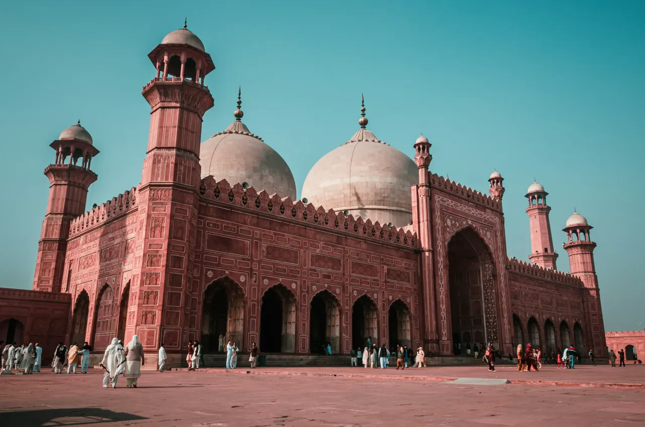 The Badshahi Mosque with red sandstone walls and white domes in Lahore, Pakistan