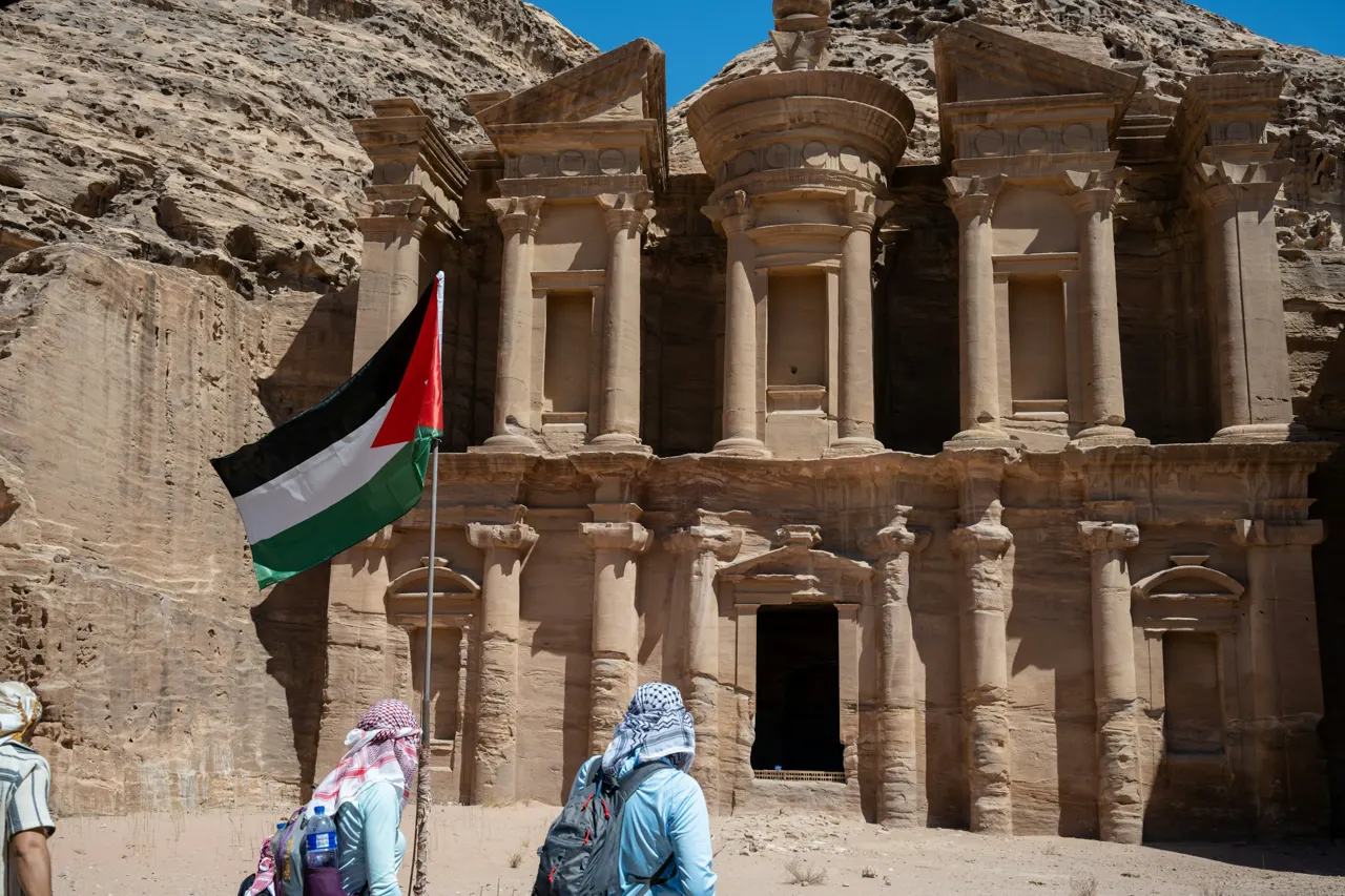 a couple of people standing in front of a building