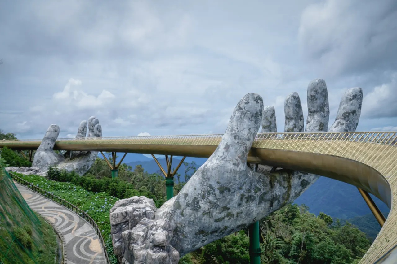 This photo was taken of the golden bridge in Vietnam in Da Nang at the Bà Nà Hills