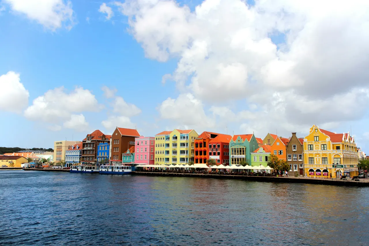 A view of the iconic Handelskade Waterfront of Willemstad as seen from the Queen Emma Bridge