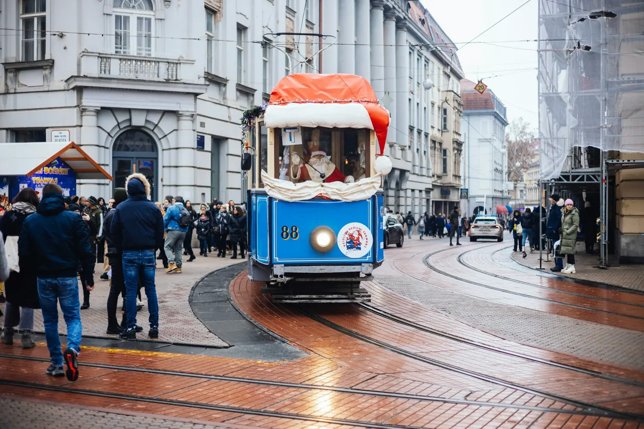 Christmas city tram operated by workers dressed as Santas