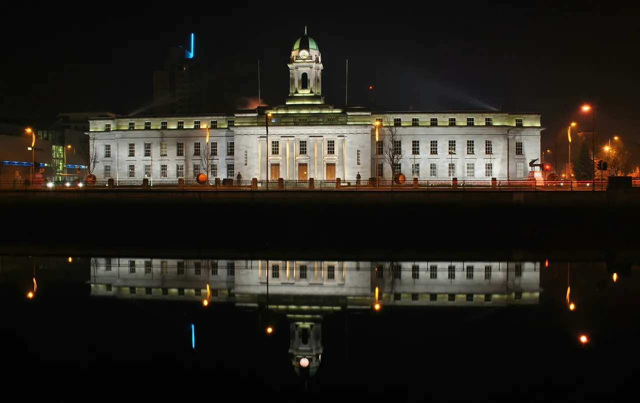 Cork City Hall is reflected in the river Lee, Cork City, Ireland