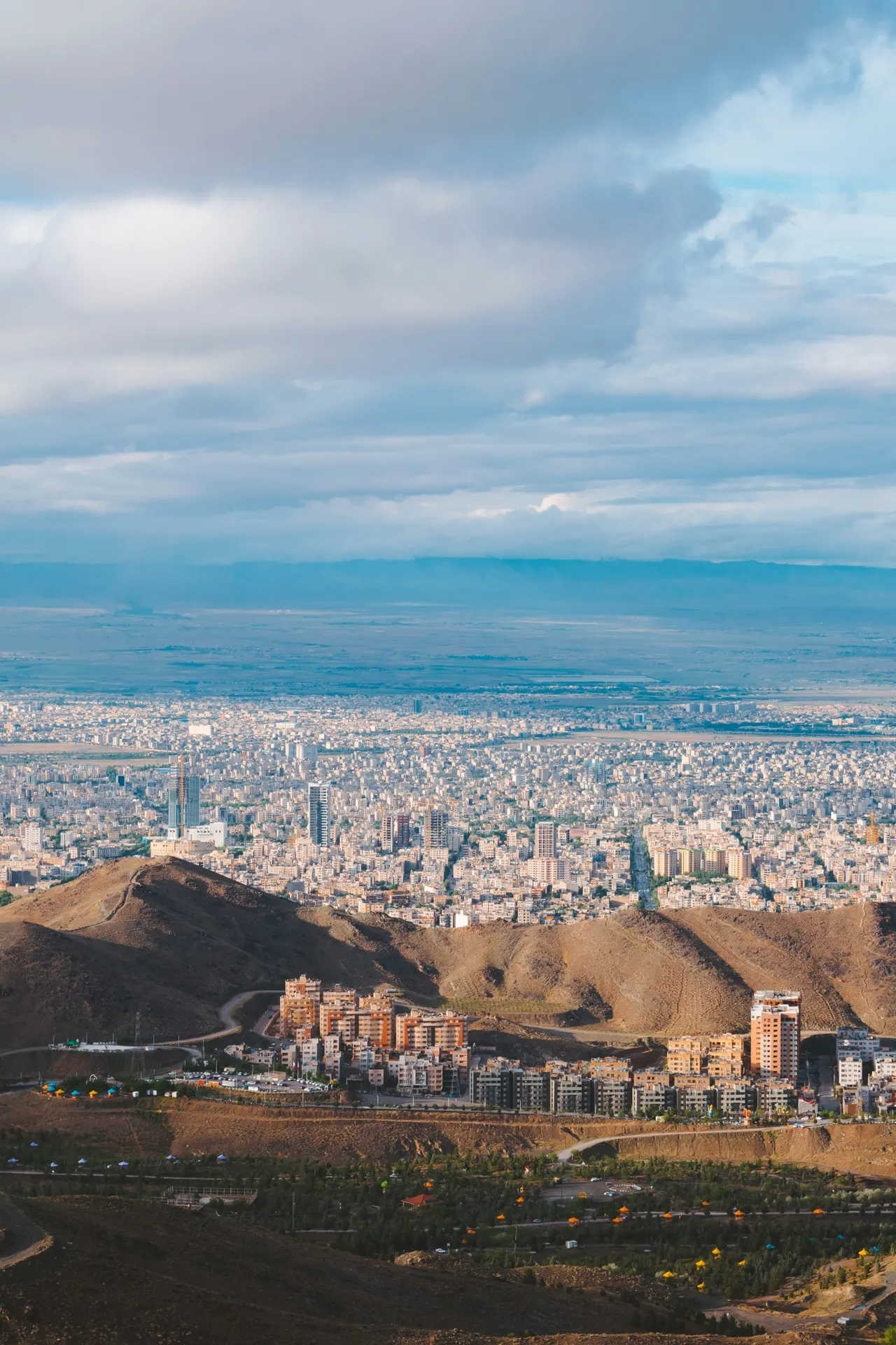Cityscape from Mashhad, Iran Downtown at sunset Mashhad is located in a valley between two mountain ranges, the valley of the Kashaf River