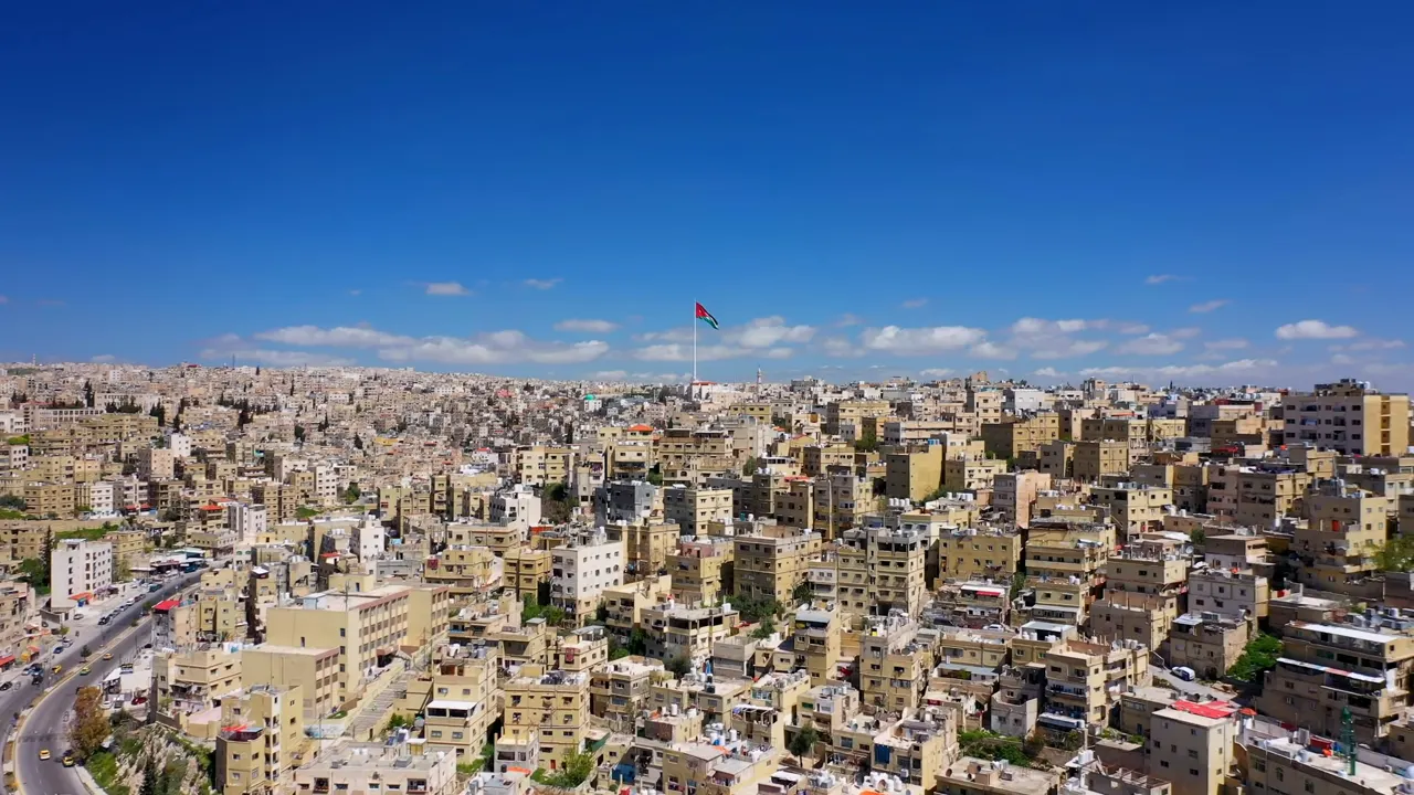 white and brown concrete buildings under blue sky during daytime