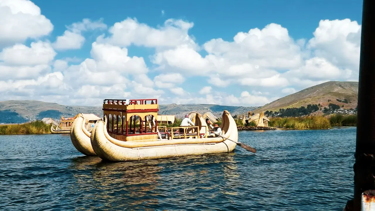 brown and white boat on water during daytime