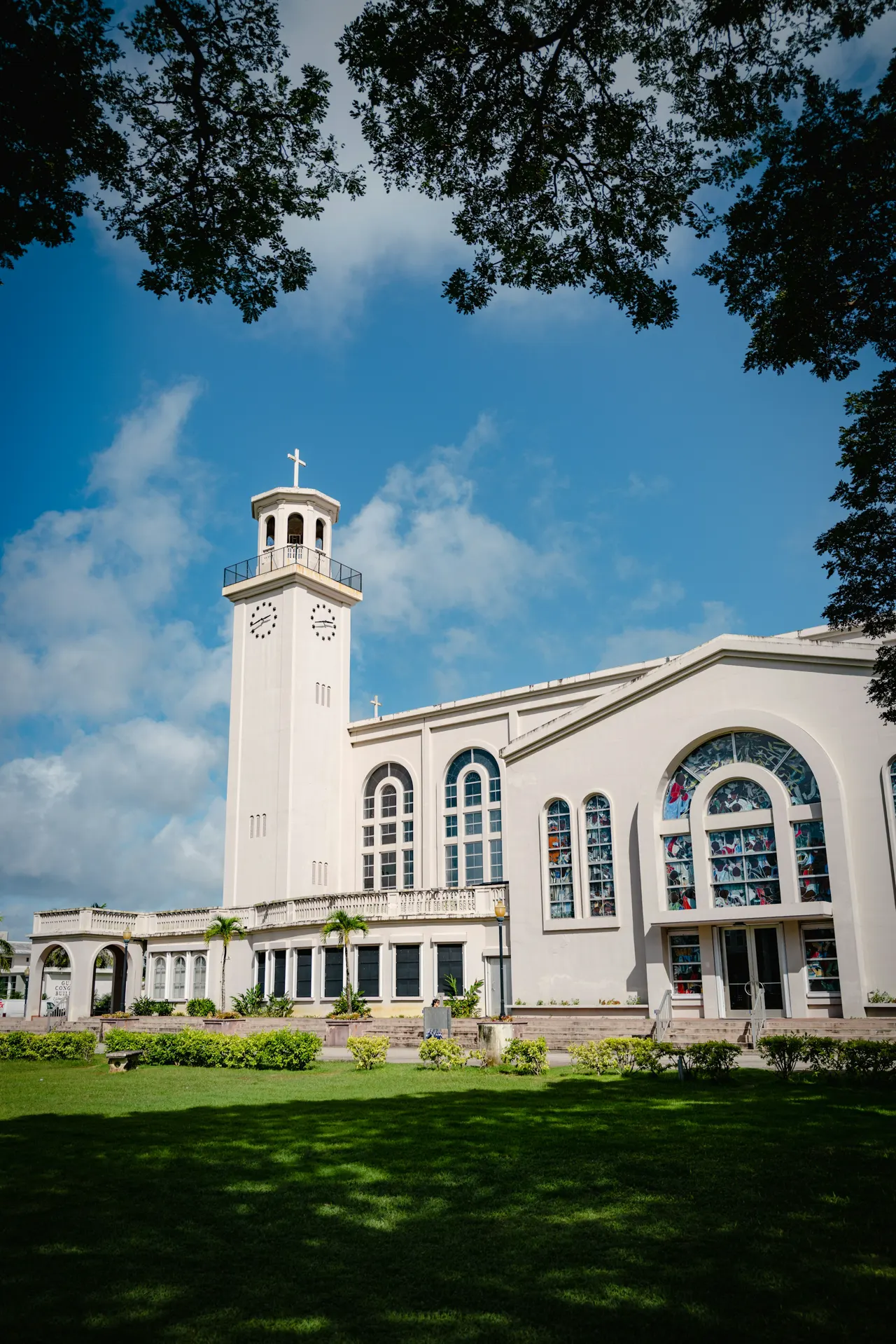 a large white building with a clock tower