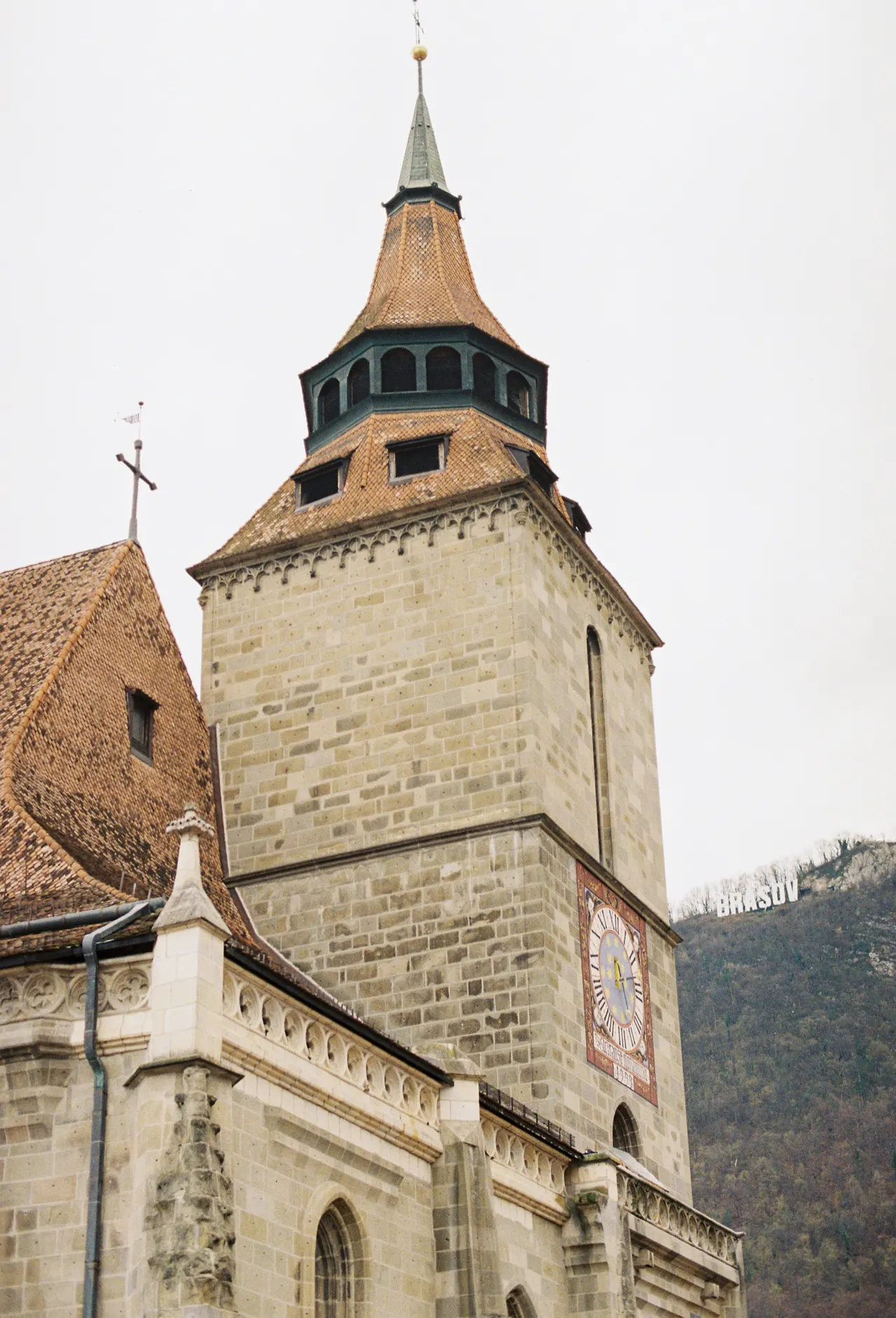 A tall, brick church steeple reaches toward the sky
