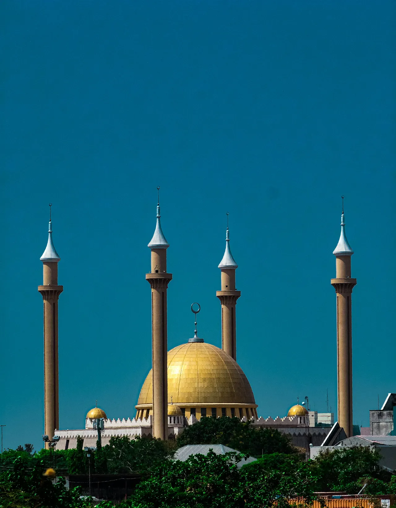 A large building with a yellow dome on top of it
