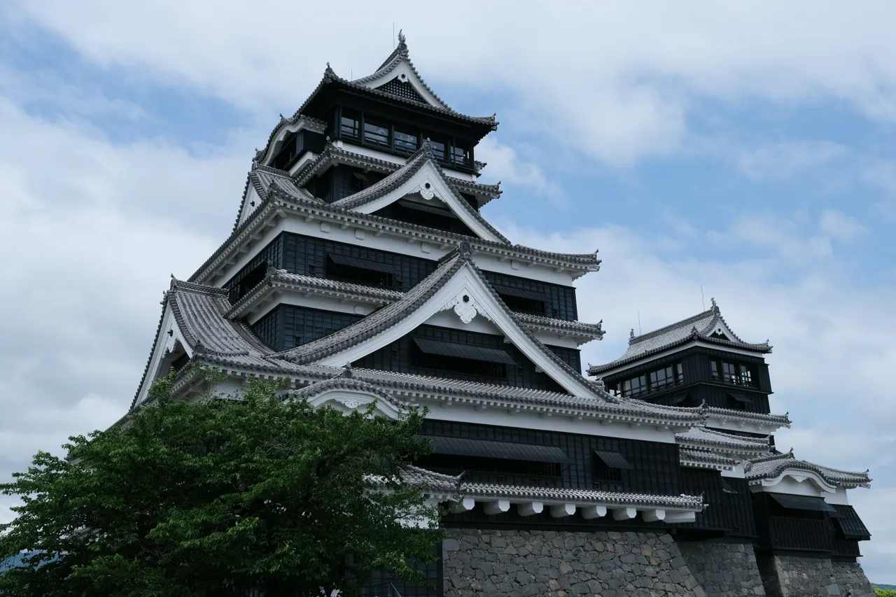 A majestic japanese castle stands tall against the sky