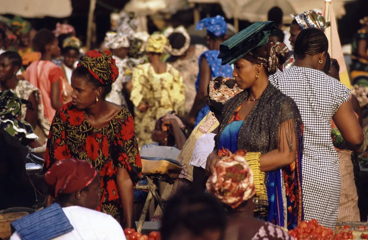 women shopping at a market in Senegal