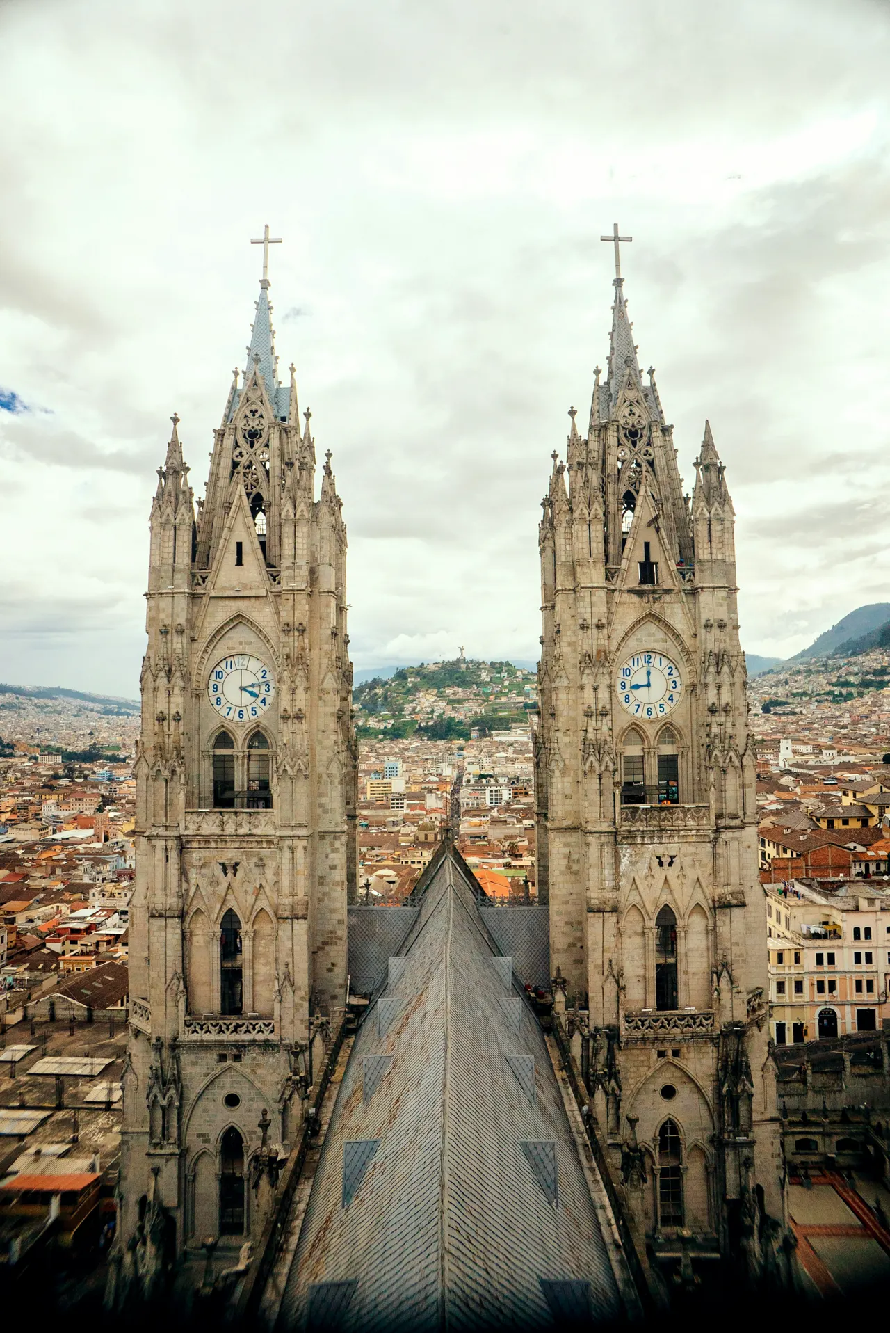 a large cathedral with two clocks on each of it's sides